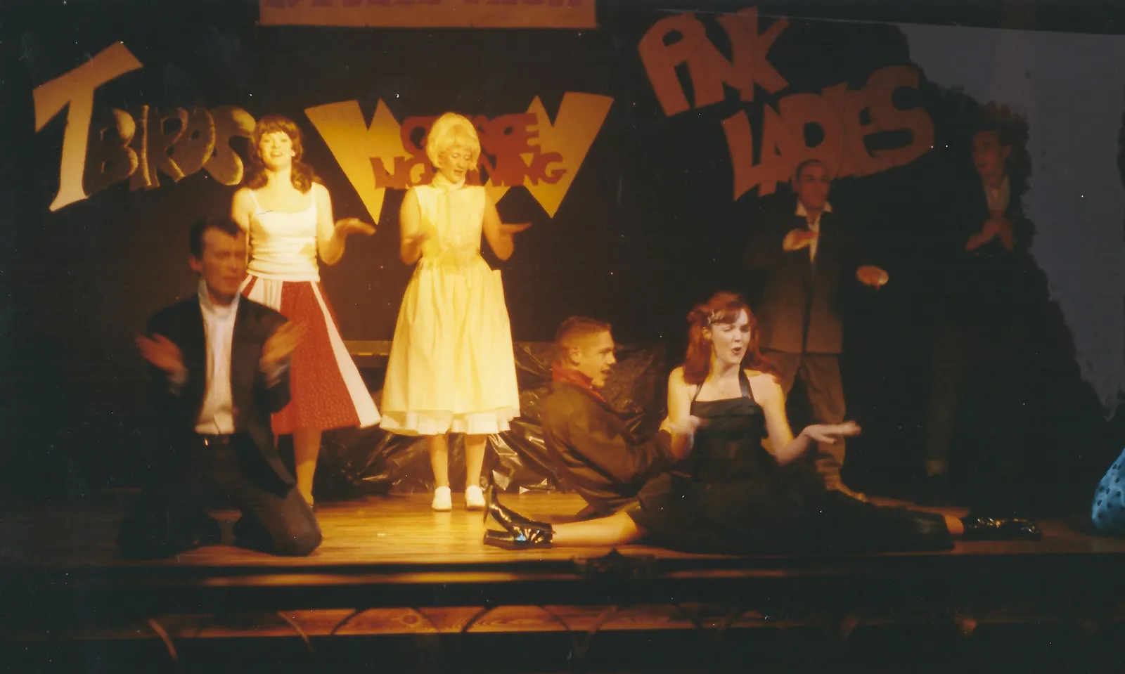 Grease theme night cast on stage at Jimmy's, T-Birds and Pink Ladies